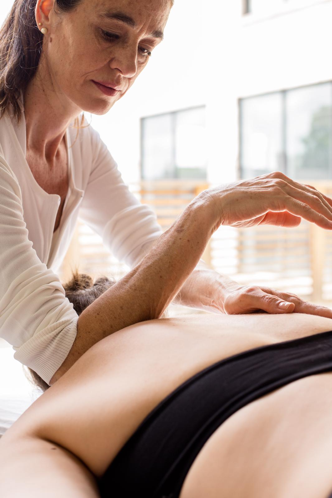 Joyce Cruvinel, Certified Rolfer, working with a client during a Rolfing session in Toronto.